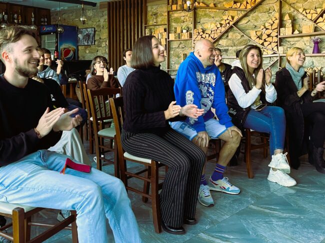 Performing stand-up comedy acts on social issues